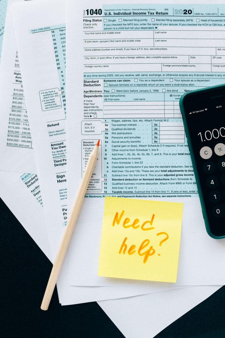 Tax documents and a calculator — capital gains tax on Spanish property
